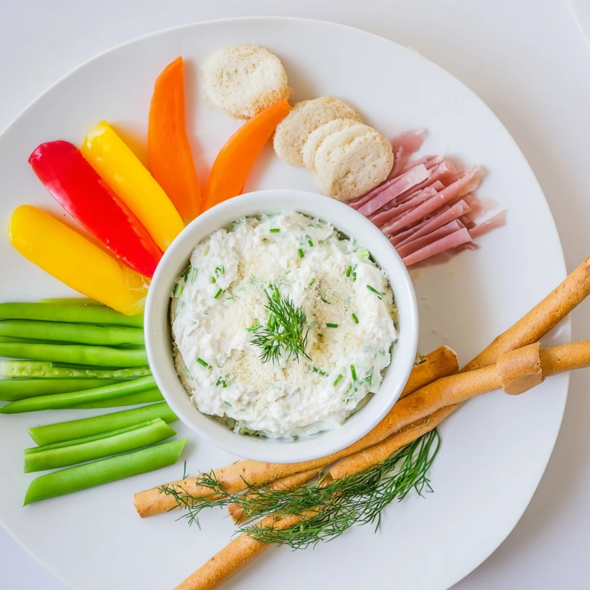 This visually appealing Reindeer Antler Spread offers savory, textured crackers with savory cured meats and a creamy dip.