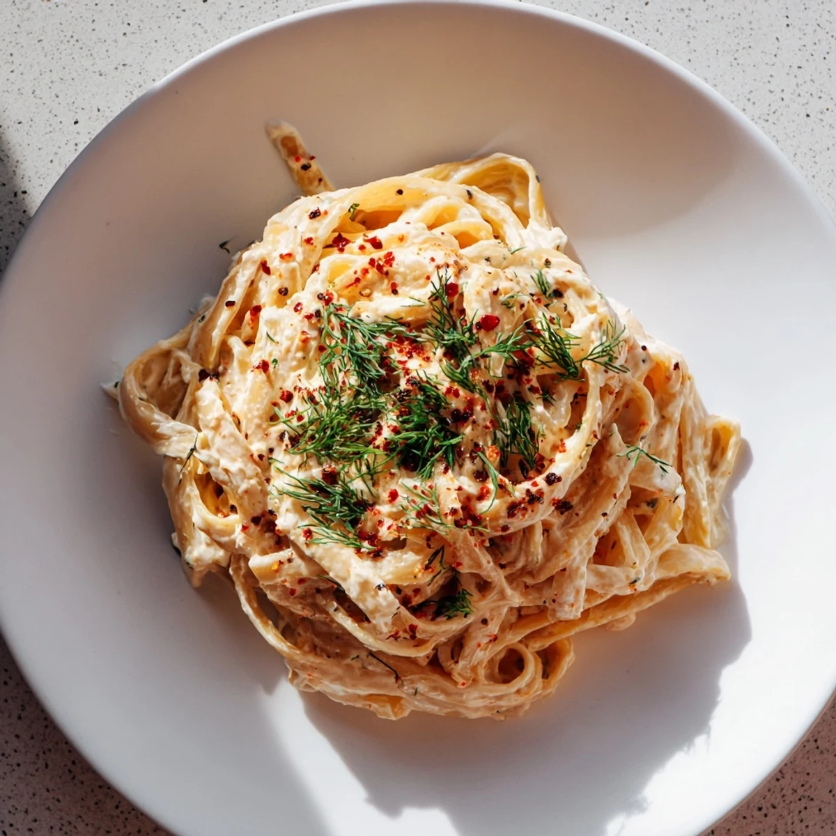 Imagine the aroma: This comforting Turkish Pasta features flavorful sauce and fresh dill garnish.