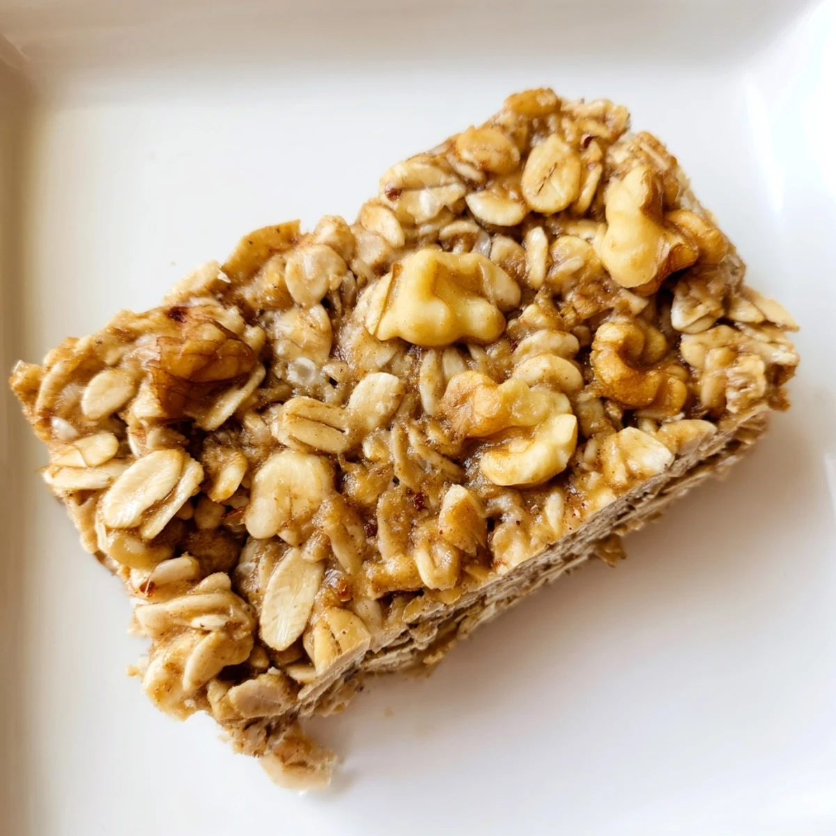 Close-up shot showing the texture of maple cinnamon oatmeal bars with optional nuts and fruit.