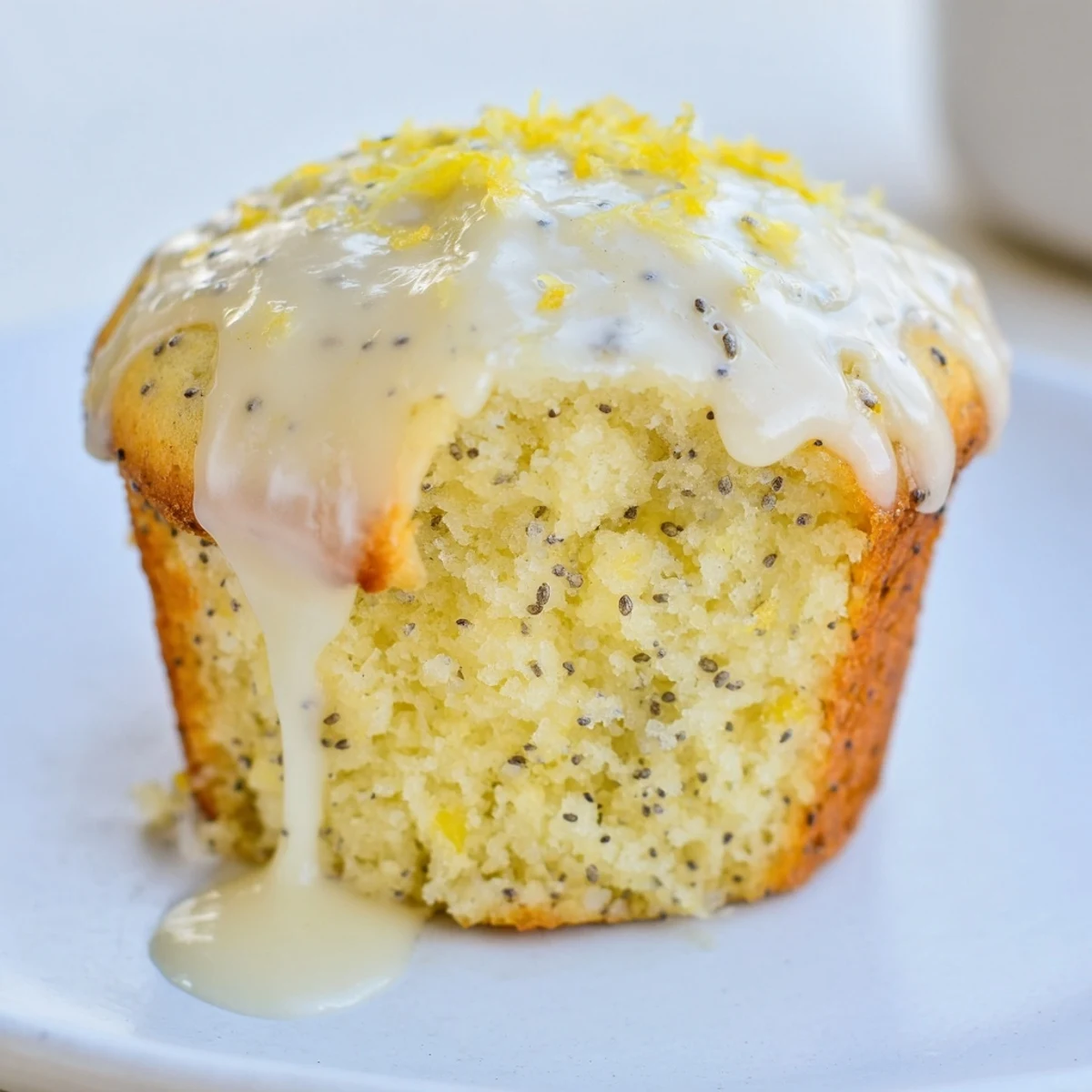 Enjoy tender Lemon Poppy Seed Muffins, perfect for brunch, alongside a cup of coffee.