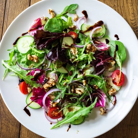 Quick Balsamic Vinegar Salad: Crisp greens and juicy tomatoes coated in a glossy, tangy reduction.