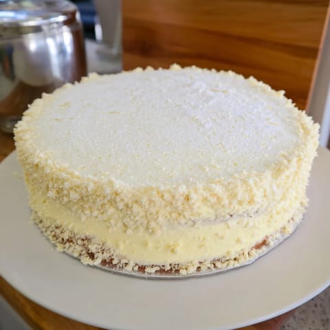 Enjoy a luxurious golden slice of the saffron and vanilla custard tart with flaky, buttery crust.