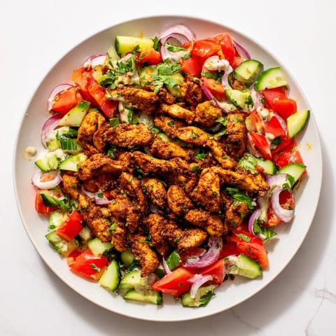 Fresh, colorful Chicken Shawarma Salad, combining tender chicken, vibrant vegetables, and flavorful dressing.