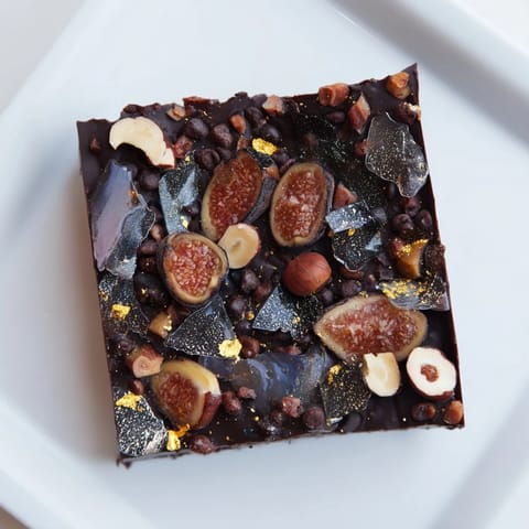 Close-up of the Midnight Mosaic dessert showing the beautiful mosaic of figs, olives, and chocolate.