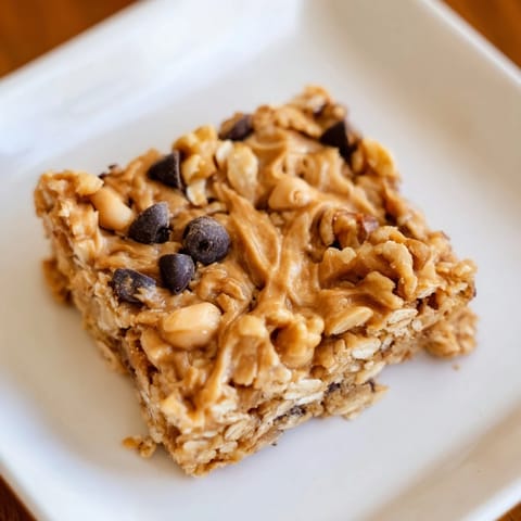 Homemade peanut butter banana oat bars, chilled and ready to enjoy on a plate, perfect snack!