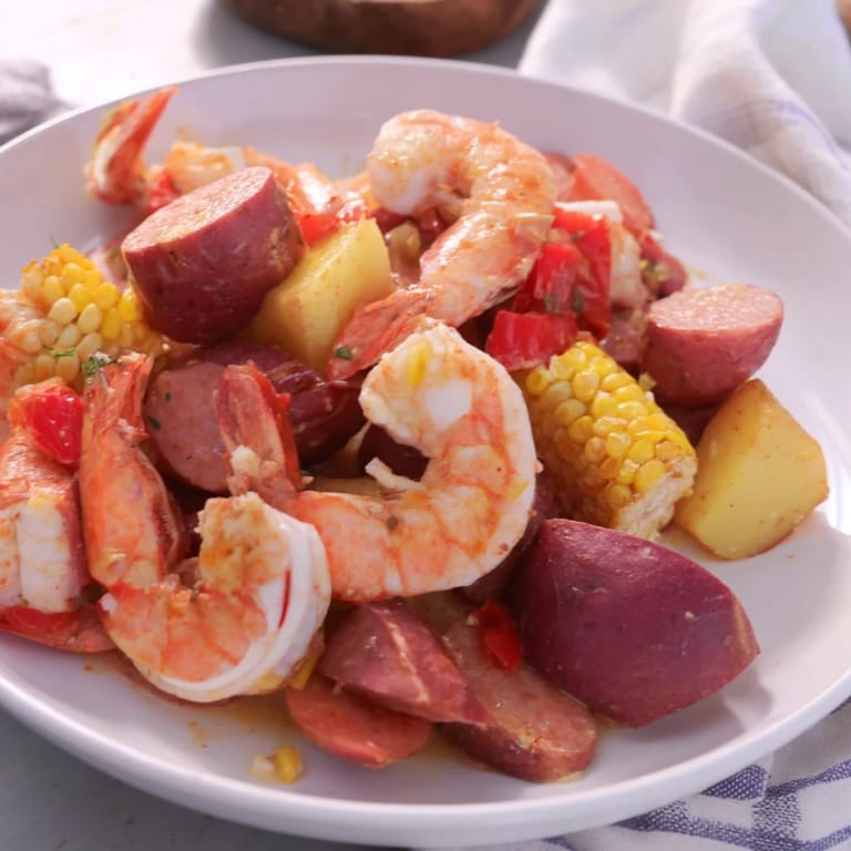 Fragrant Seaside-Inspired Shrimp Boil arranged on a serving platter, ready to be enjoyed with lemon wedges.